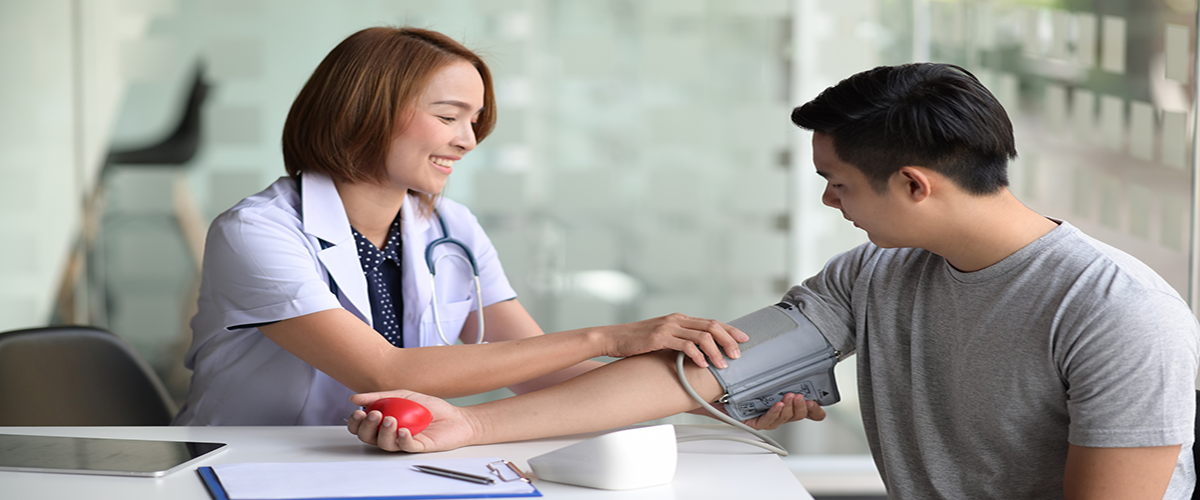 nurse checking blood pressure